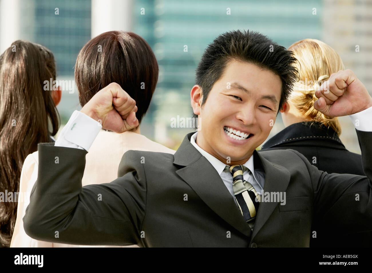 Young Asian businessman cheering Stock Photo