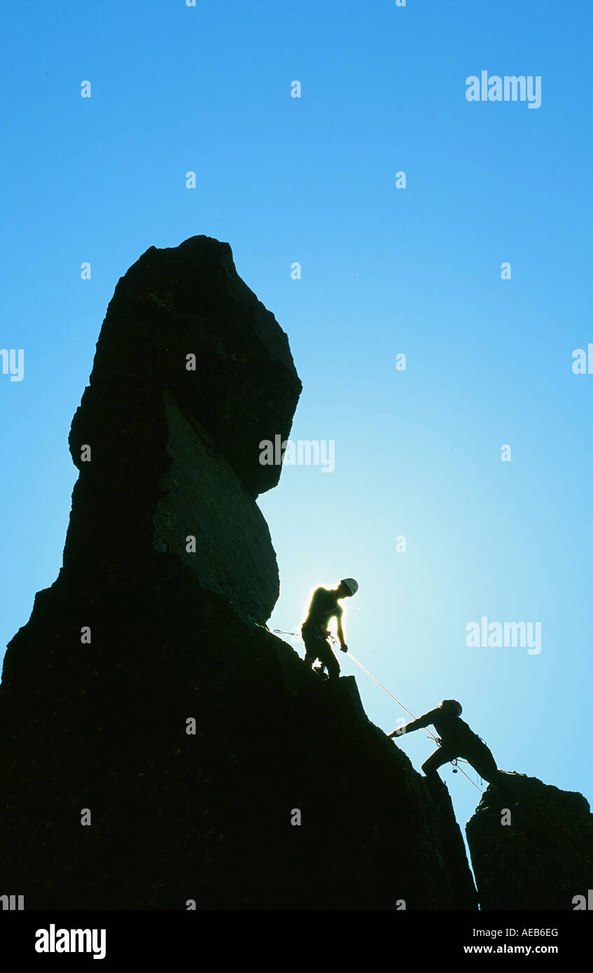 Climbers on Napes Needle, a classic Lake District climb on Great Gable, Cumbria, UK Stock Photo