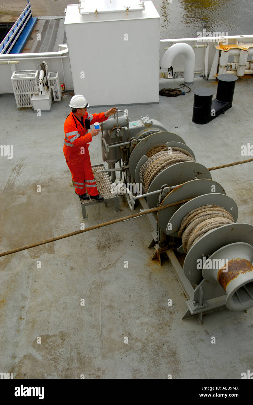 Crewman on ferry operating winch, North Sea, Scotland Stock Photo Alamy