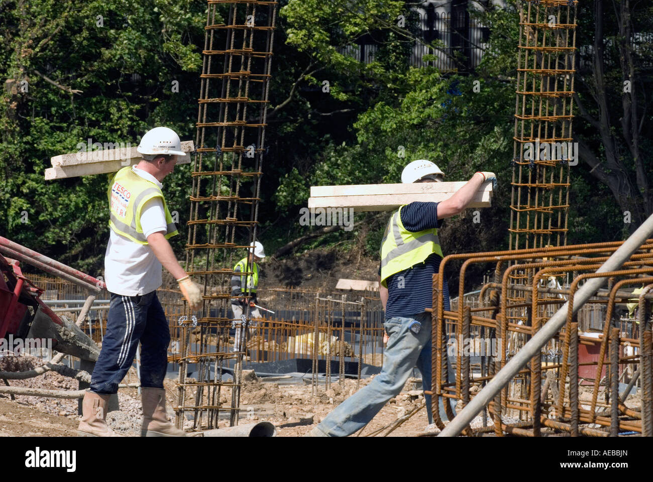 Construction workers on building site carrying materials, Milton Keynes