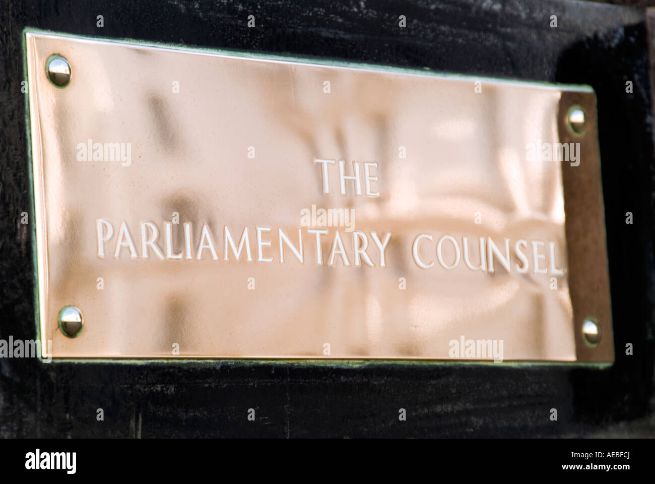 Brass name plaque of The Parliamentary Counsel government office in Whitehall Central London UK Stock Photo