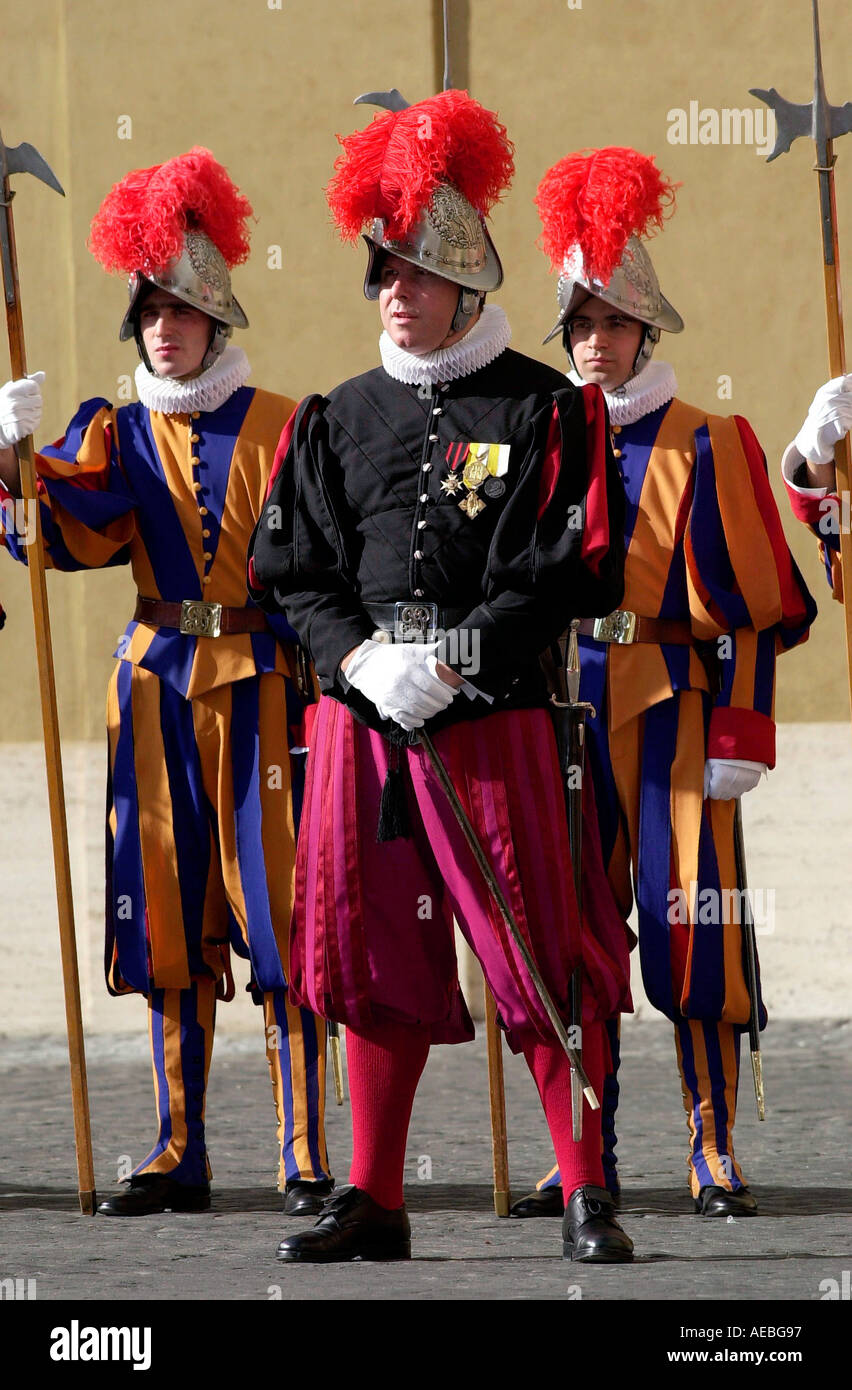 SWISS GUARDS IN PLUMED HELMETS AND STRIPED UNIFORMS AT THE VATICAN CITY Stock Photo