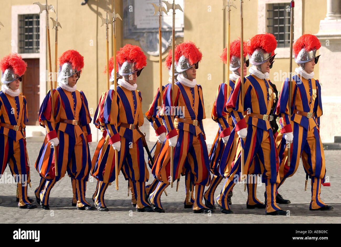 SWISS GUARDS IN PLUMED HELMETS AND STRIPED UNIFORMS AT THE VATICAN CITY Stock Photo