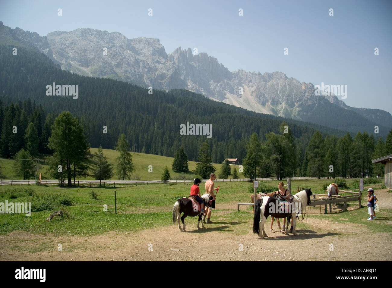 Children horse riding in the Dolomites Sud Tyrol Italy Stock Photo Alamy