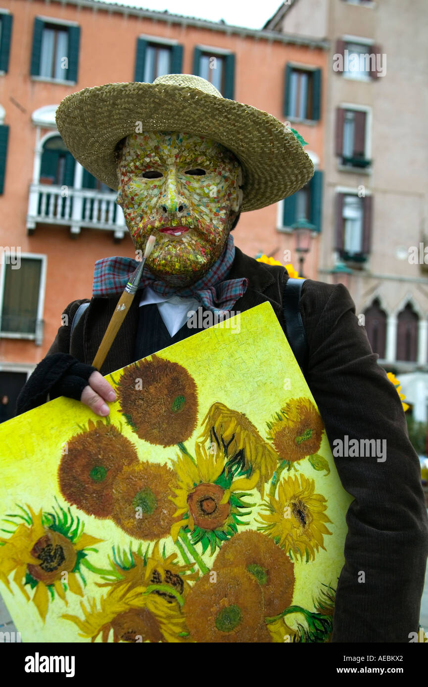 Carnival in Venice, character dressed as the painter Vincent van Gogh holding a sunflower painting, Venice, Italy Stock Photo