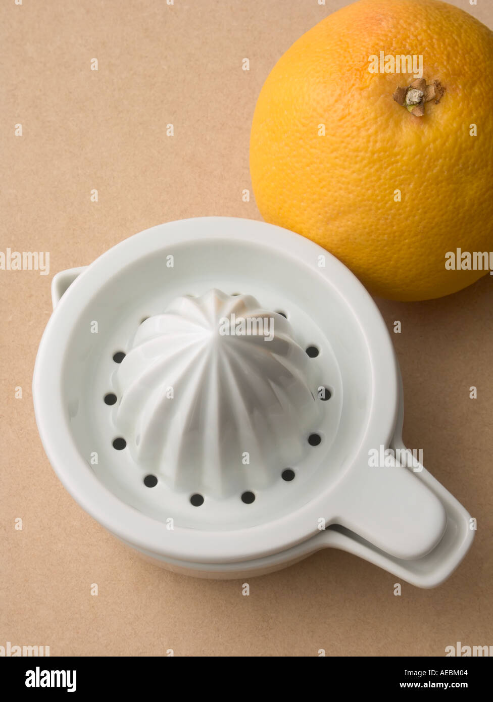 Juice squeezer with orange Stock Photo Alamy