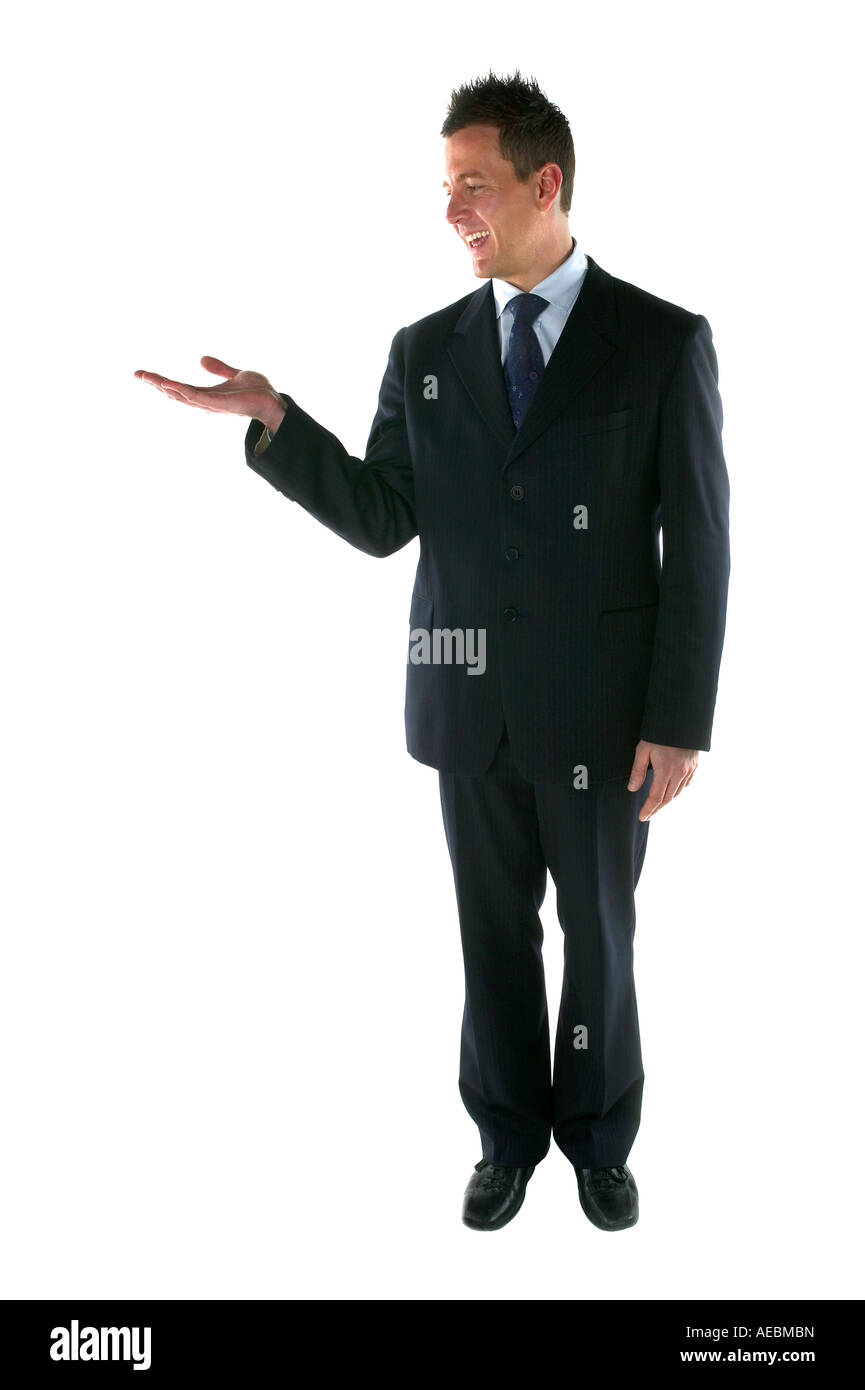 Businessman in a suit his hand out for a product placement Isolated on white Stock Photo