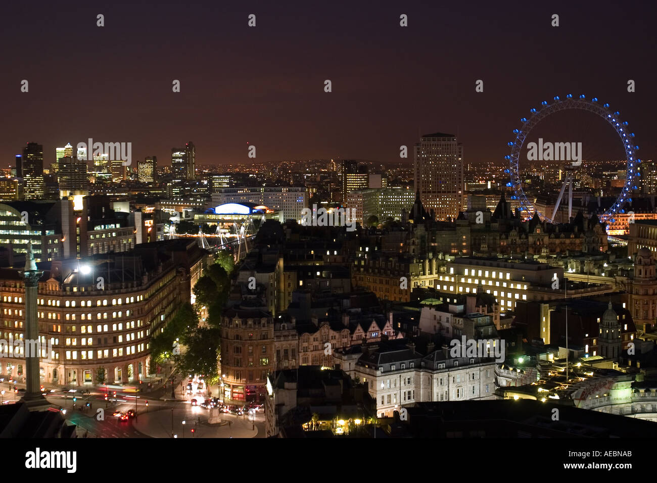 Night view of Londpn from the rooftops showing London Eye Nelson s Column Strand Trafalgar Square Charing Cross and beyond Stock Photo