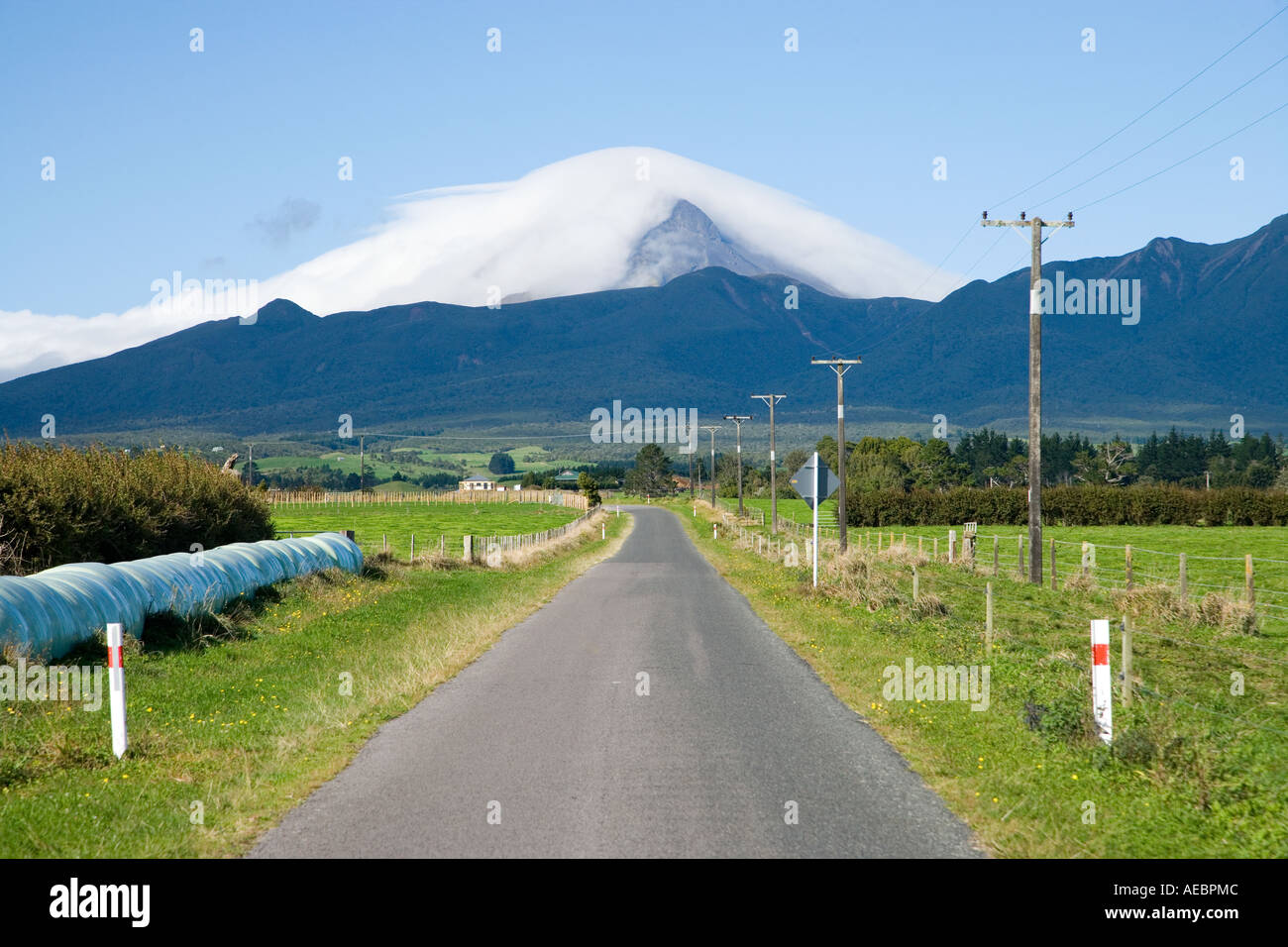 Road And Mt Taranaki Egmont Taranaki North Island New Zealand Stock road-and-mt-taranaki-egmont-taranaki-north-island-new-zealand-stock