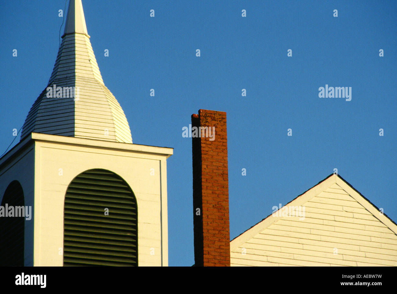 Steeple chimney and roof peak of New England colonial church Cape