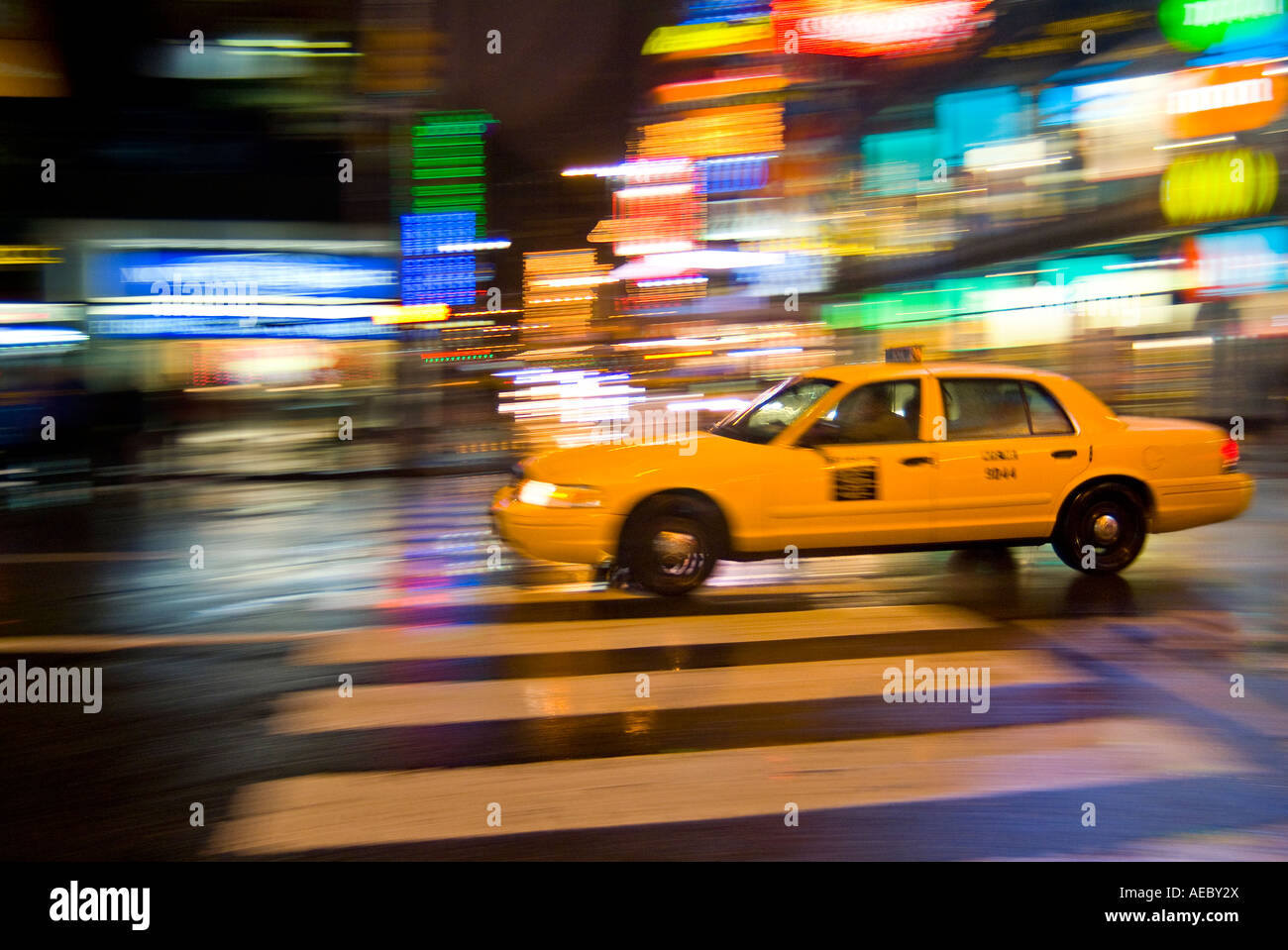 Taxi Cab, New York City At Night With Motion Blur And Bright Lights, Times Square, New York City, USA Stock Photo