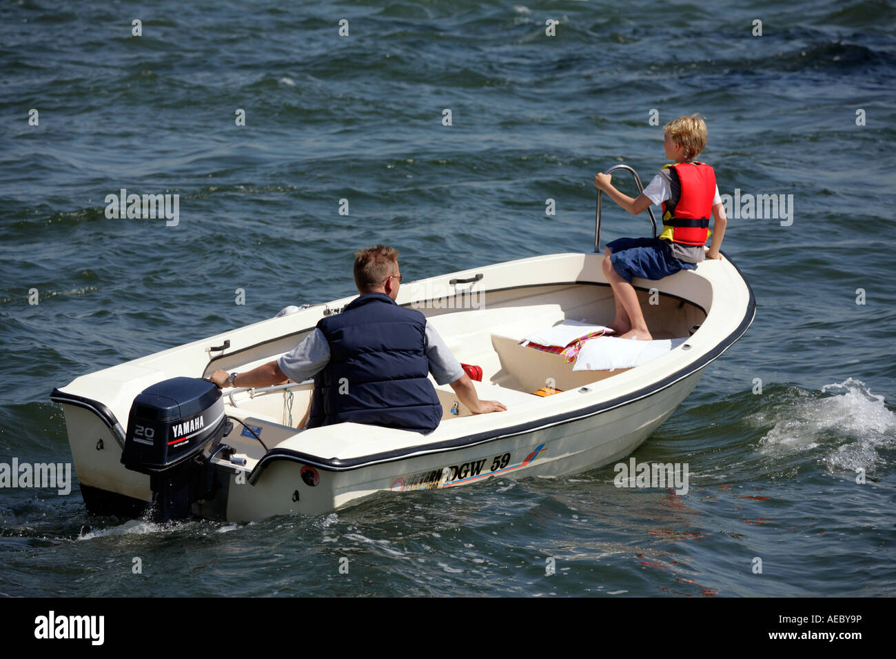 Man sitting on a boat hi-res stock photography and images - Alamy