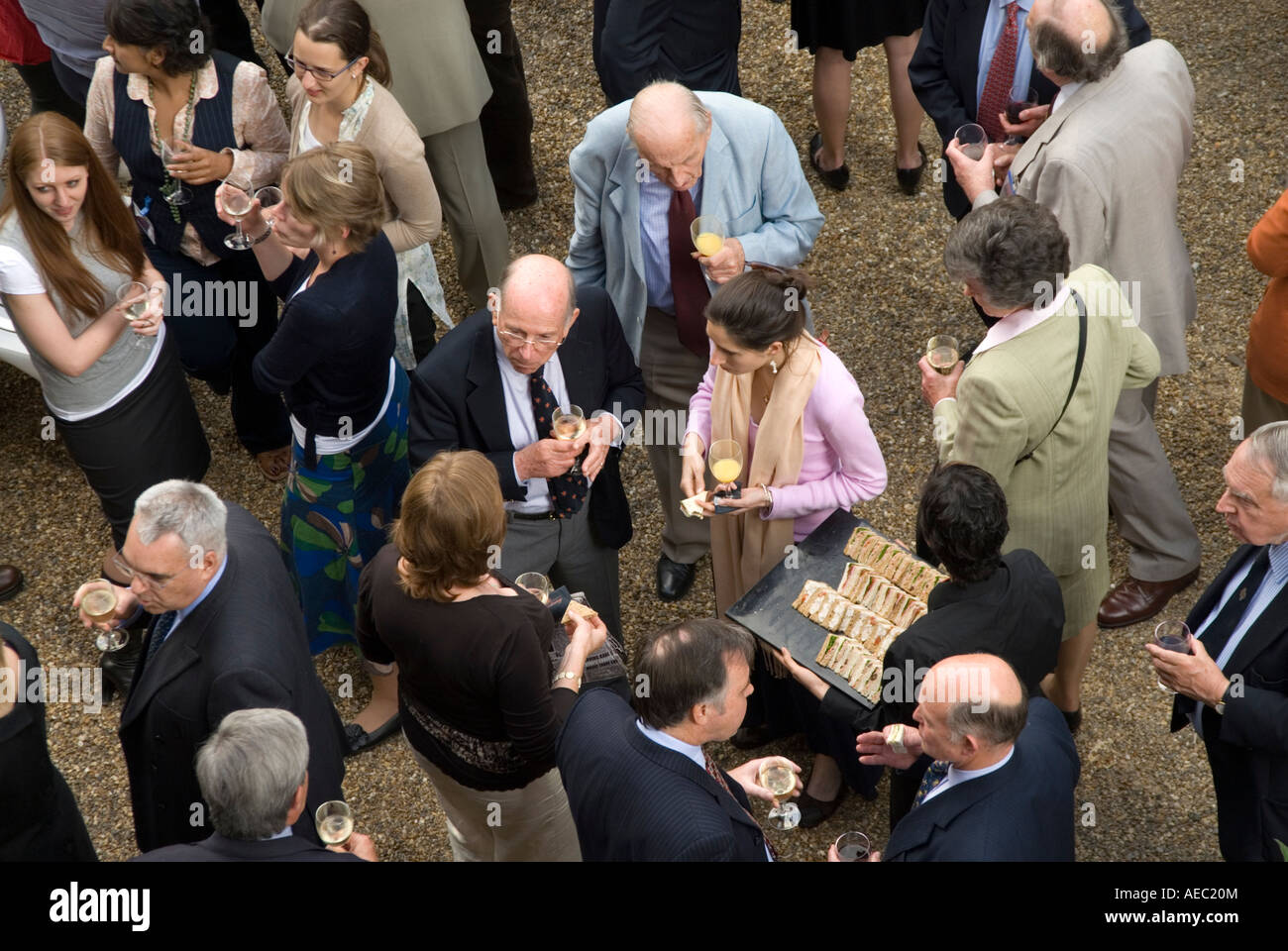 English people drinking and socialising at society event London England UK Stock Photo