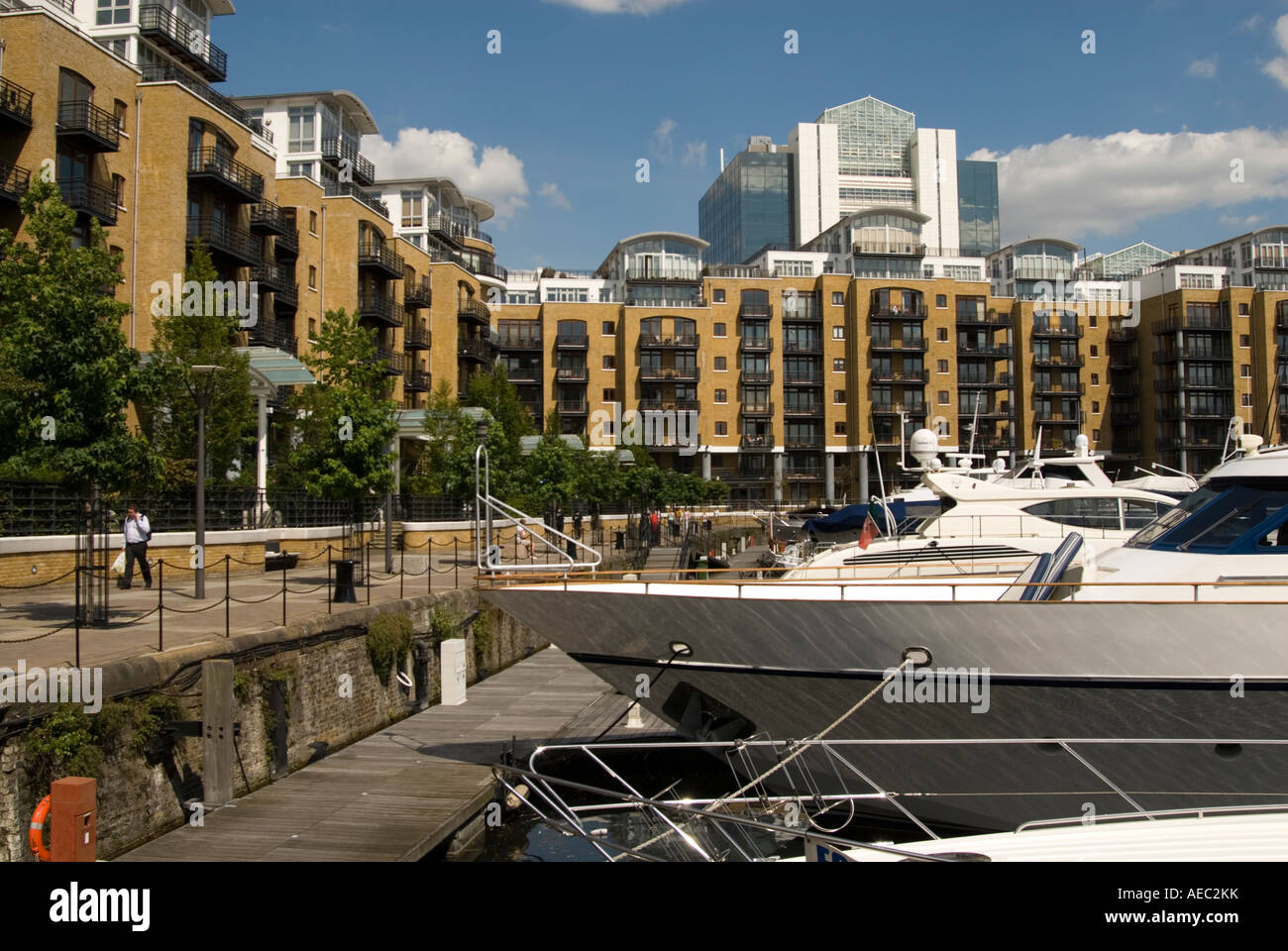 Yachts and apartments at St Katherine's Dock, London England UK Stock Photo