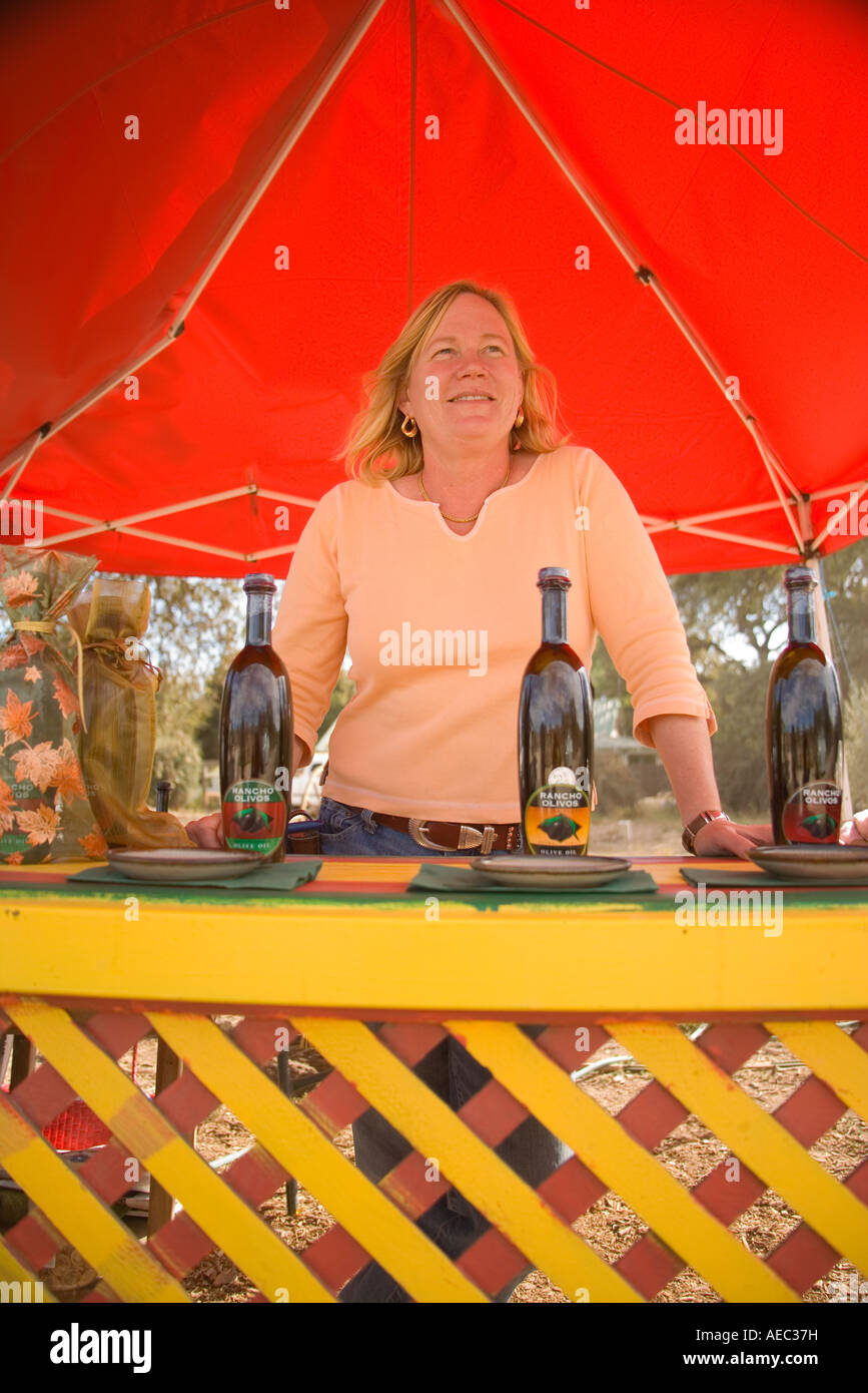 Shannon welcomes visitors to her olive oil tasting stand Rancho Olivos Santa Ynez Valley California Stock Photo