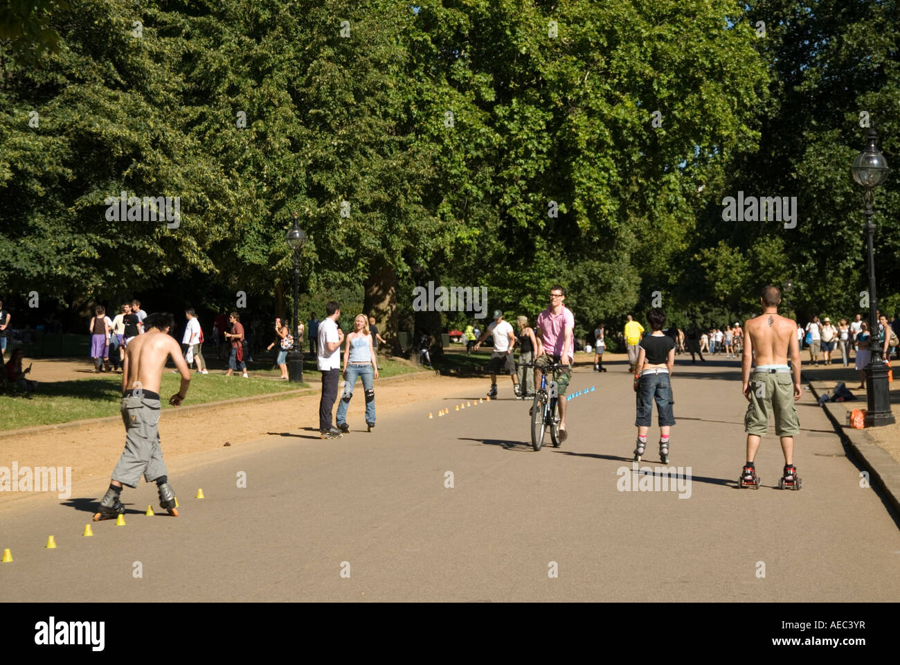 Young people rollerblading in Hyde Park London England UK Stock Photo