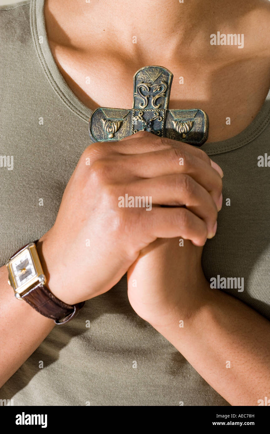 Hands holding a Cross. Stock Photo