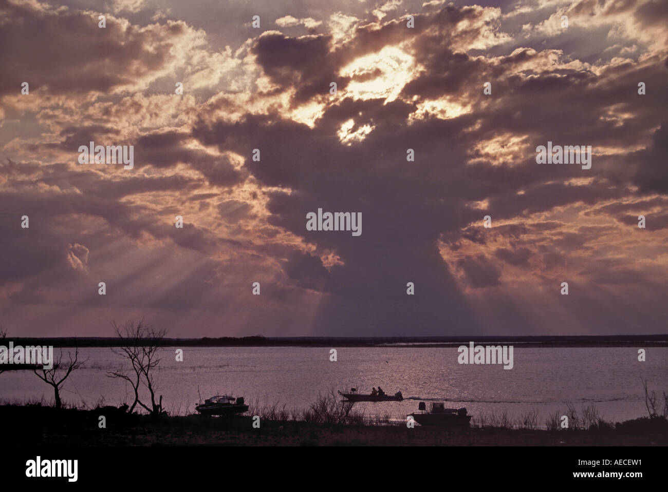 Boats, people at sunset at Calliham Unit of Choke Canyon Reservoir, Texas, USA Stock Photo