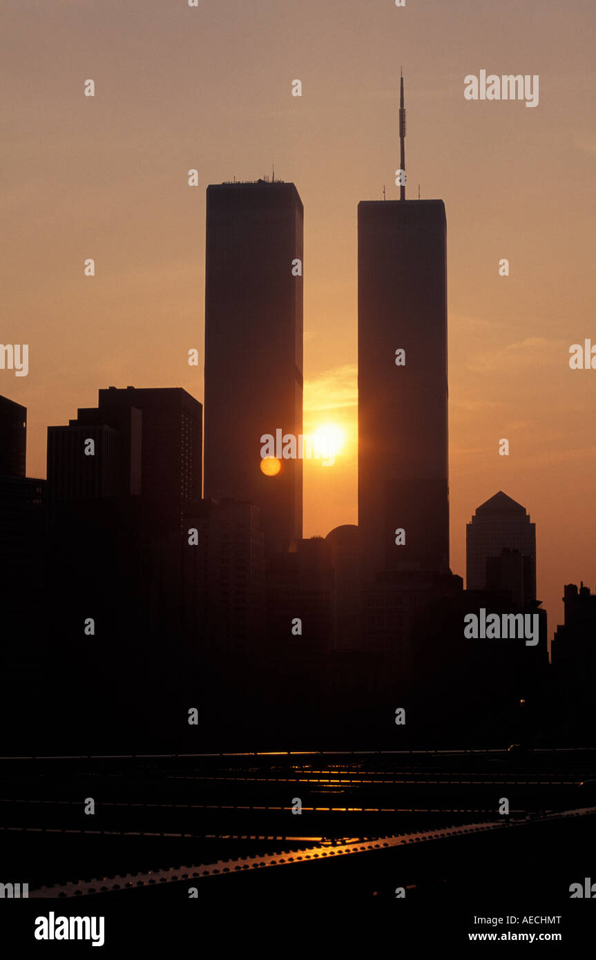World Trade towers frm the base of the brooklyn bridge with sun setting behind NYC Stock Photo