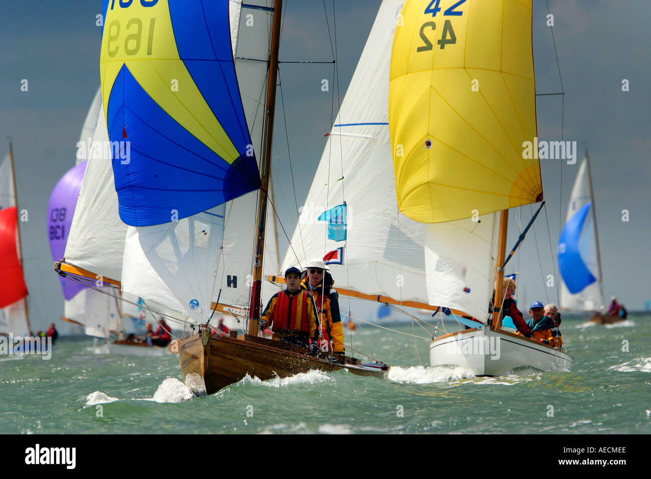 Cowes week sailing isle of wight england spinnaker run hires stock