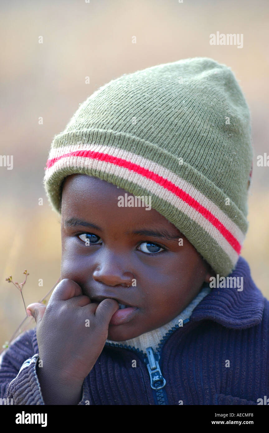 Little African child with beanie on head at Pandamatenga border post Botswana Africa Stock Photo