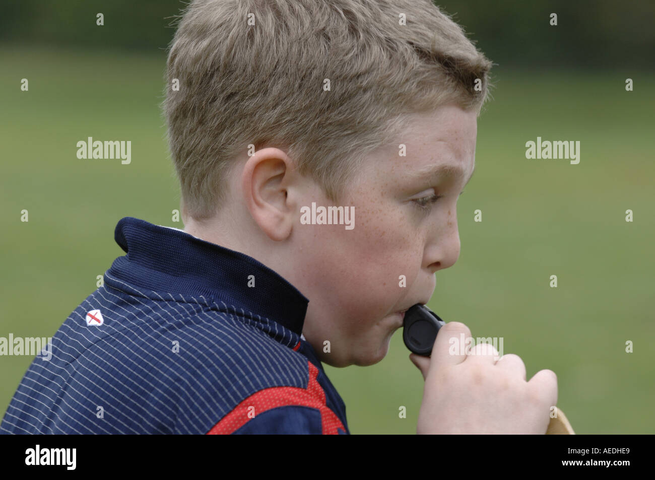 boy learn referee whistle blow blower kid young eleven sport pe school education caucasian male