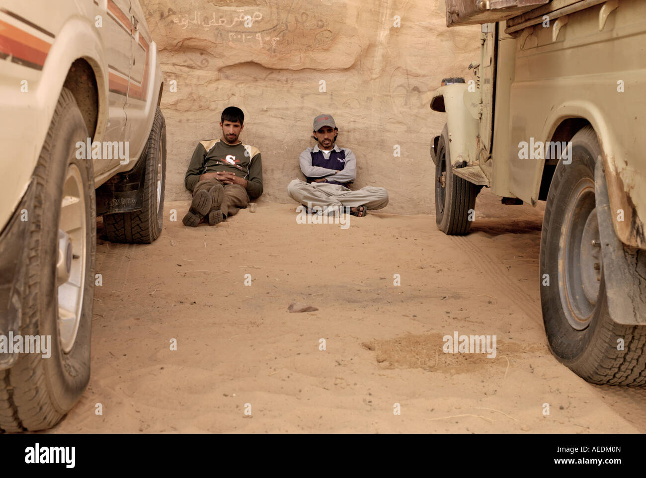 Two Arabs relaxing in desert Stock Photo