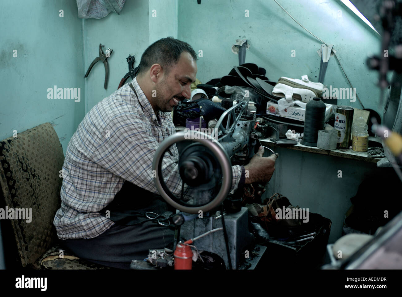 Man in petra shop mending shoes Stock Photo