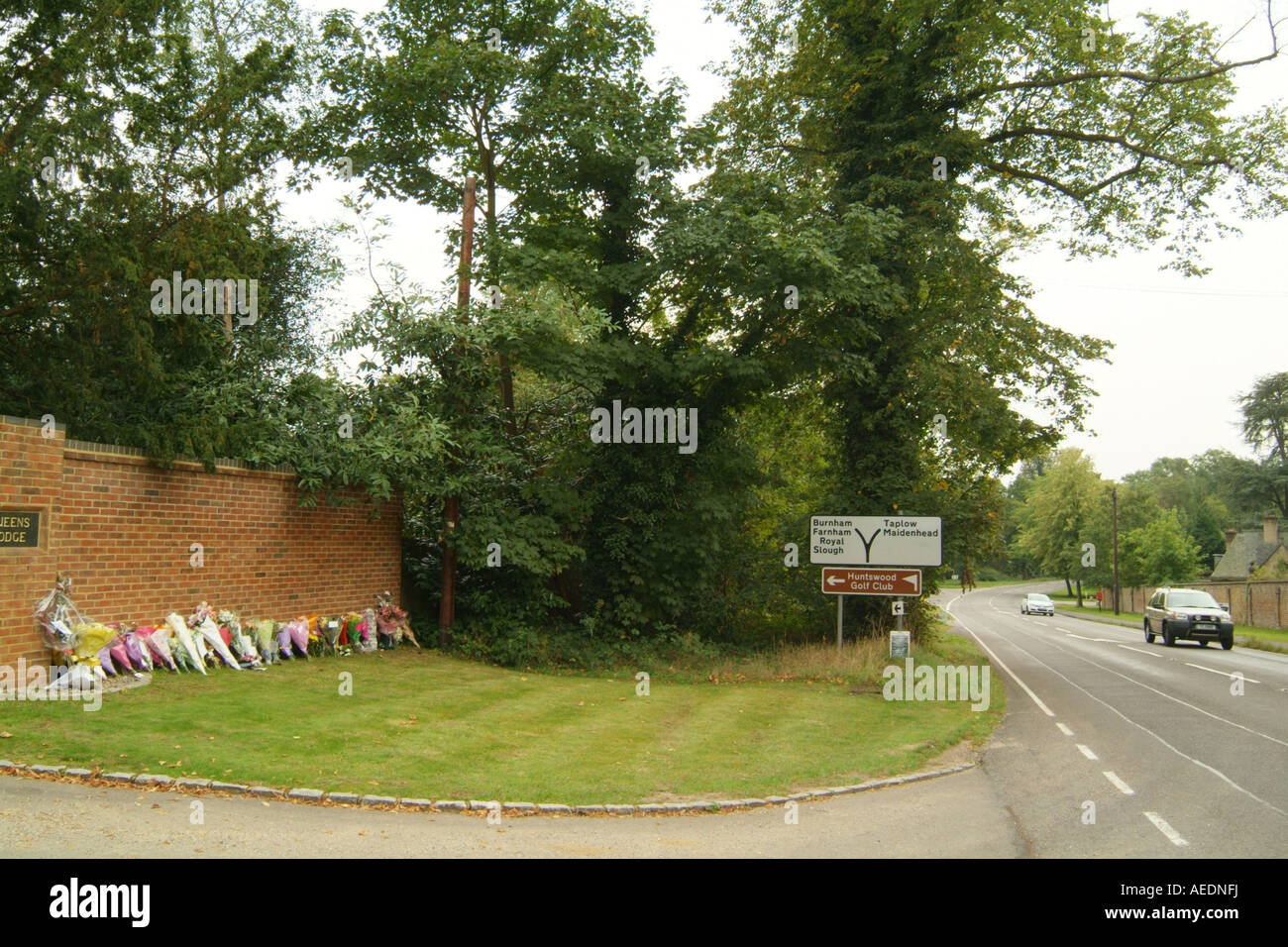 Floral tributes left by the road where a policeman was killed in an accident. Stock Photo