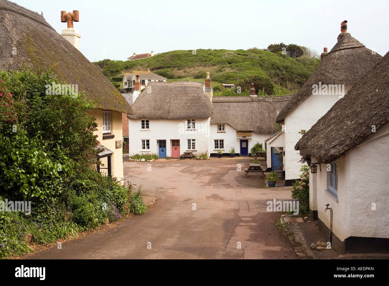 UK Devon Inner Hope thatched cottages in village square Stock Photo