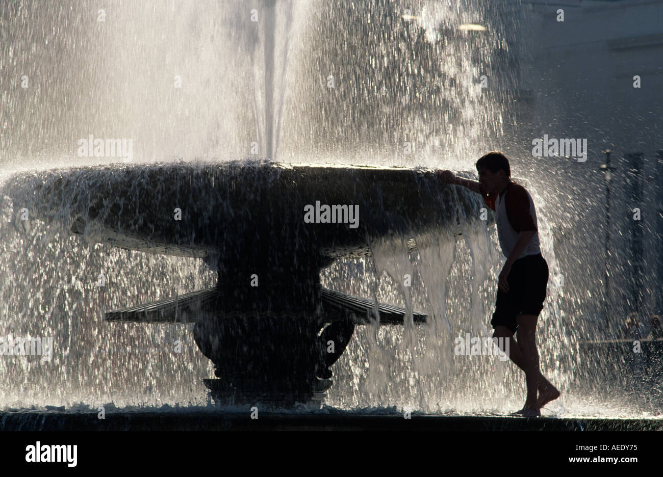 Man In Fountain Trafalgar Square London U K Stock Photo