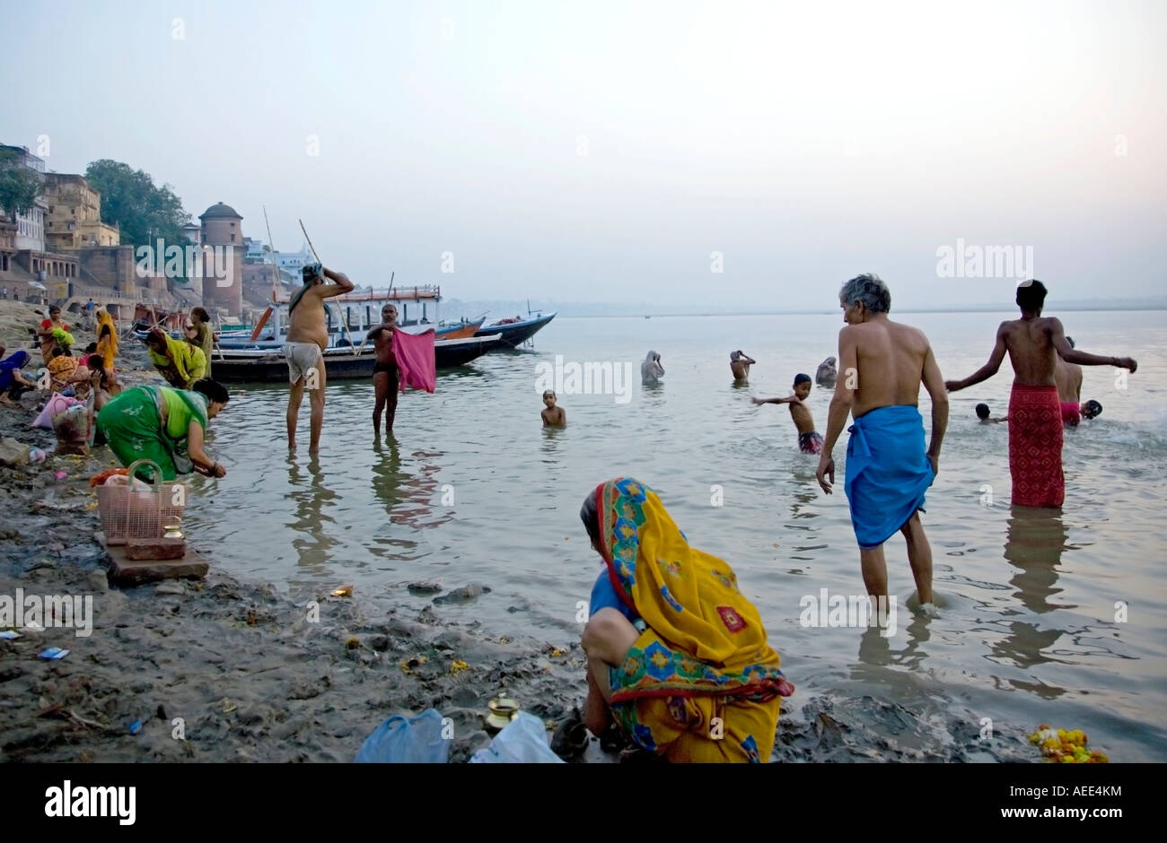 Morning ritual bath assi ghat hi-res stock photography and images - Alamy