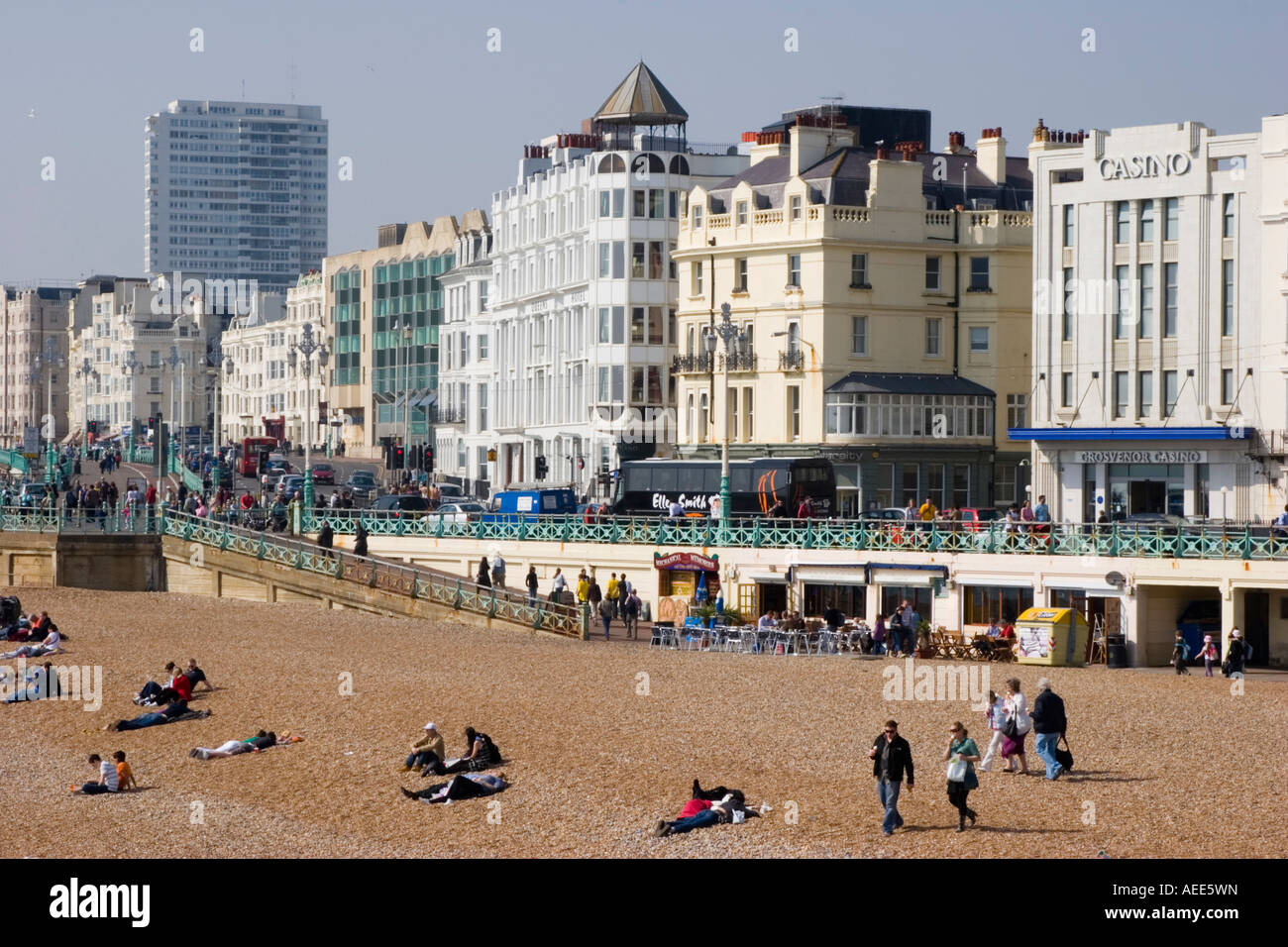 A busy and crowded Brighton beach and sea front on an unseasonably warm day in April Stock Photo