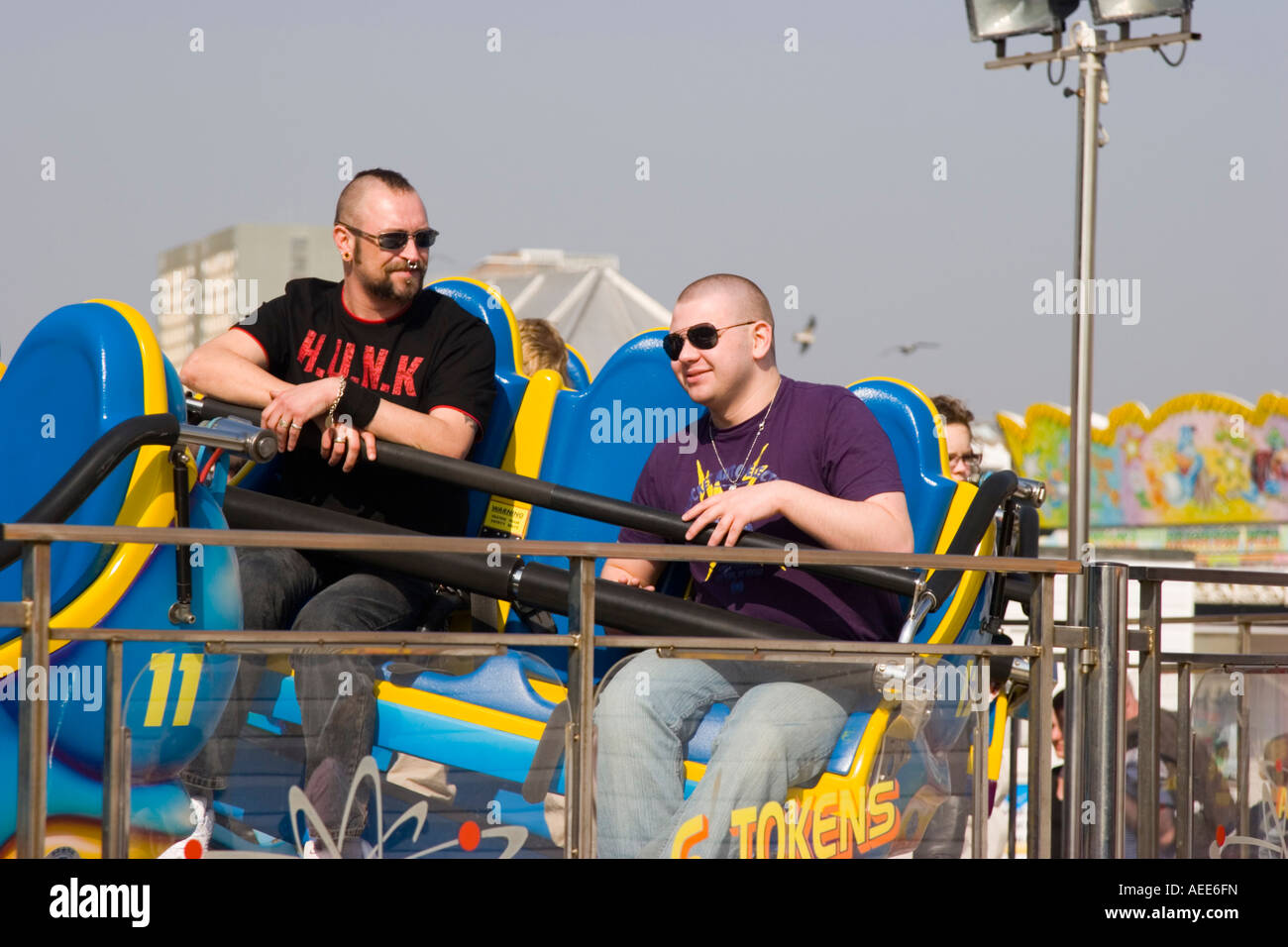 People enjoying a fairground ride Stock Photo