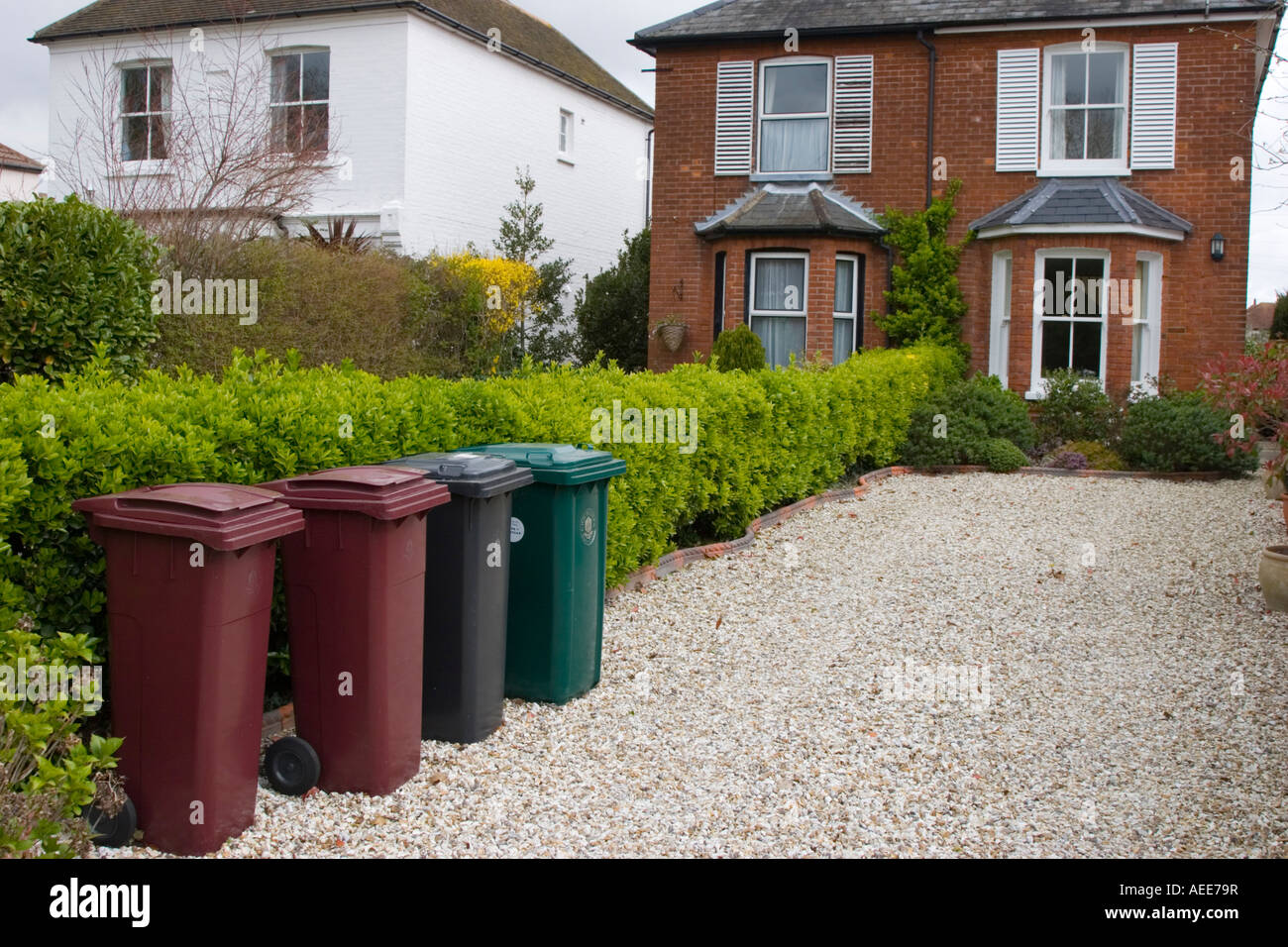 Wheelie bins neatly lined up outside a detatched house Stock Photo Alamy