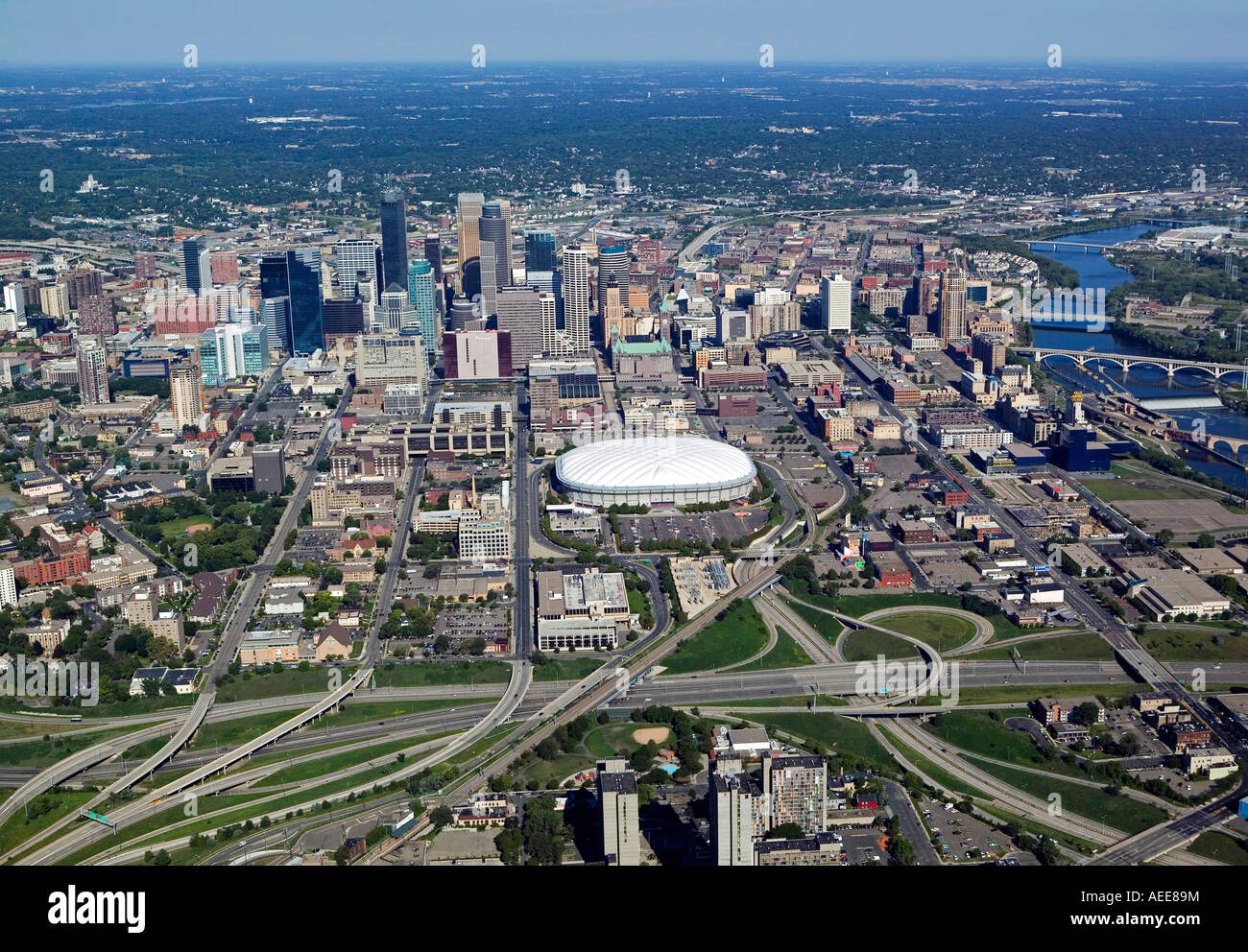 aerial above Minneapolis, MN from the south toward the Metrodome and downtown with the Mississippi river on the right Stock Photo