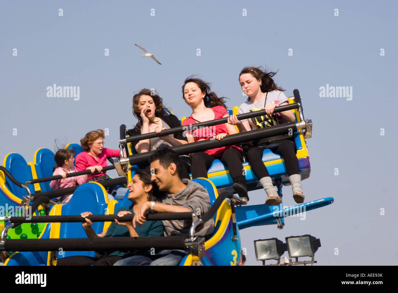 People enjoying a fairground ride Stock Photo