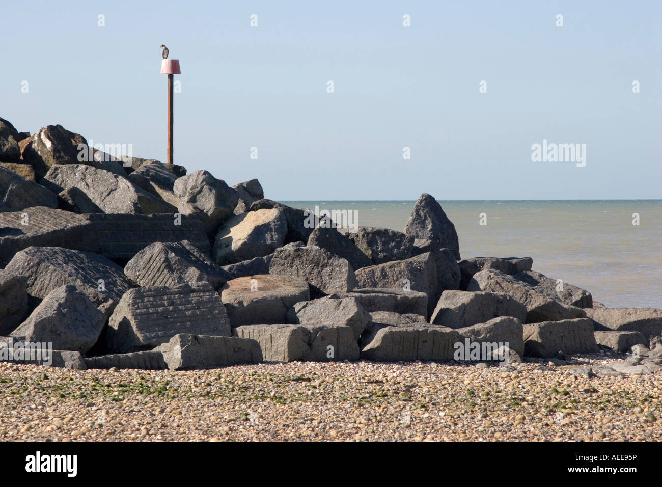 Sea defence scheme consisting of piles of large rocks and boulders Stock Photo