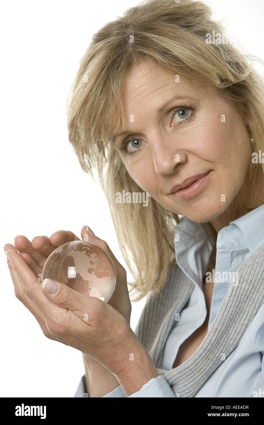 A woman holding a crystal globe Stock Photo - Alamy