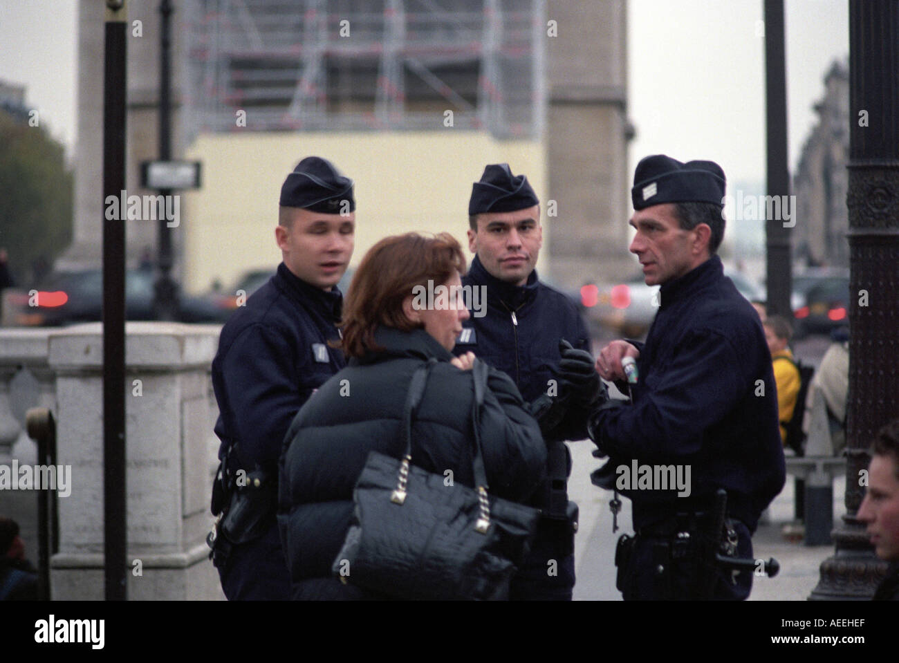 Police officers on duty on the Champs-Élysées in Paris France Stock Photo