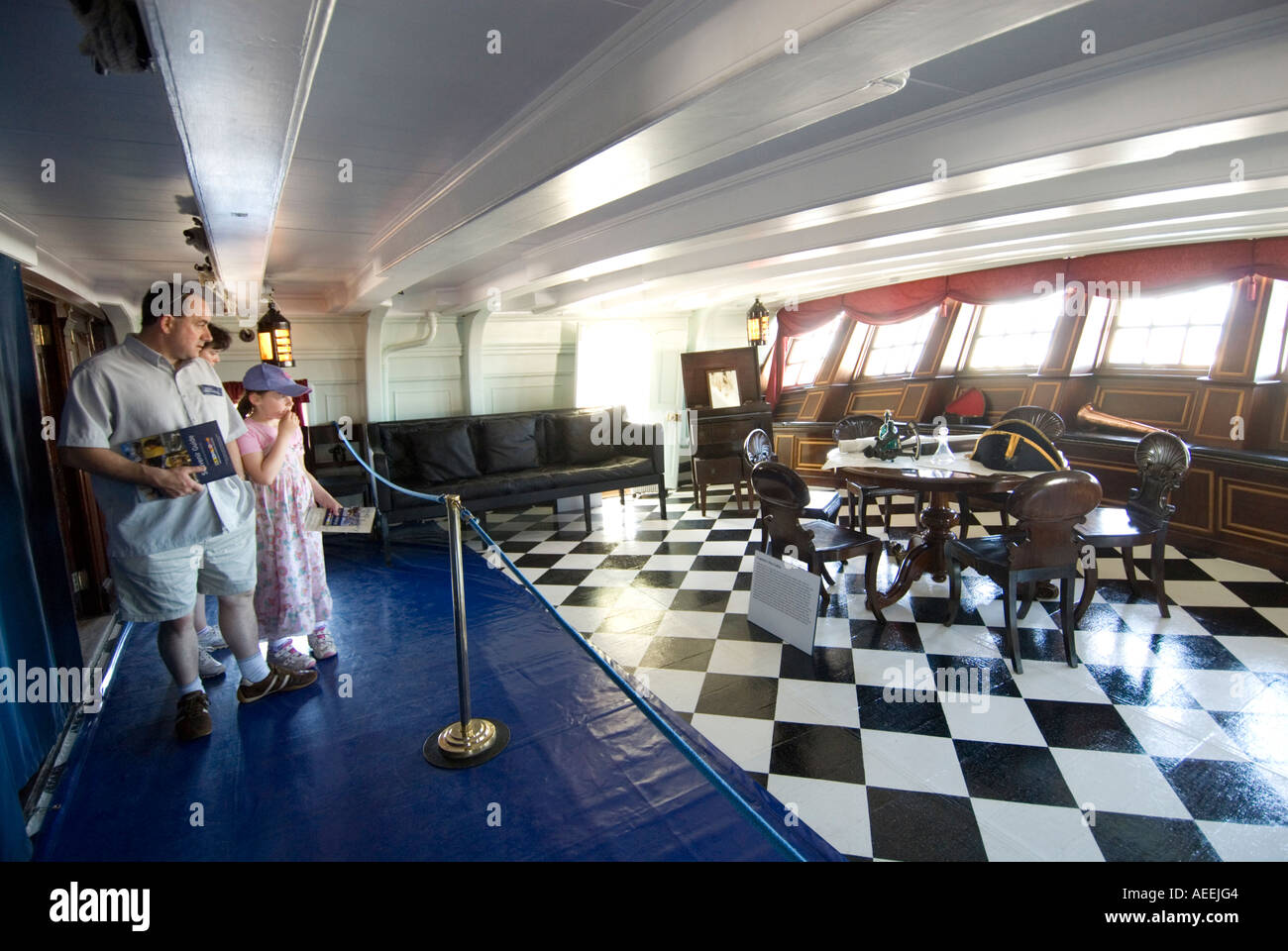 Visitors in the Captain's Day Cabin on the HMS Victory, England UK Stock Photo