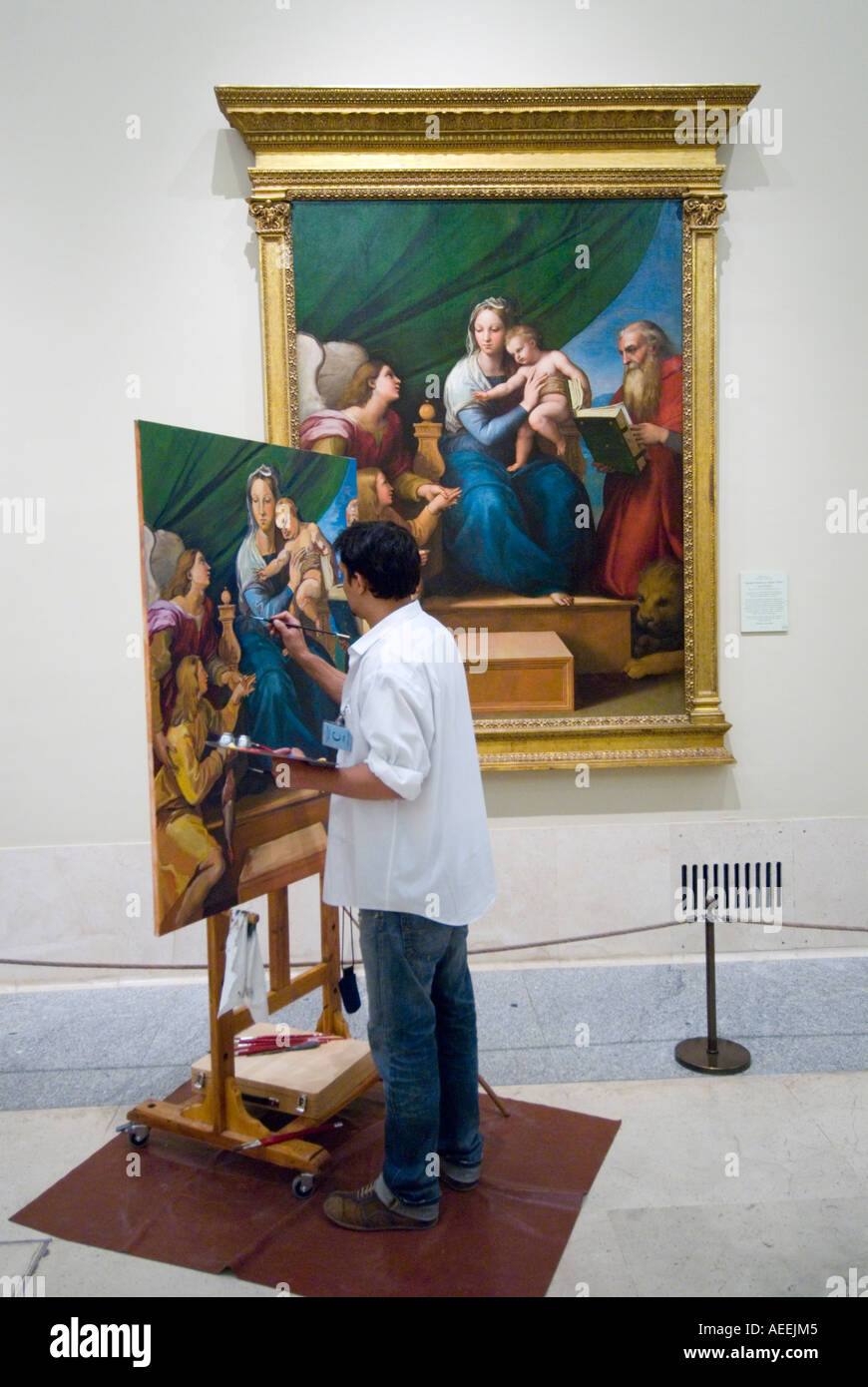 Artist copying old master painting Madonna with the Fish by Raphael in the Museo del Prado, Madrid, Spain Stock Photo