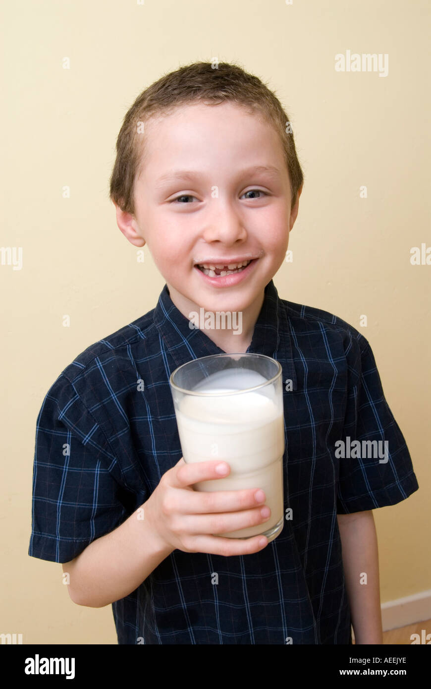 Boy drinking glass of milk England UK Stock Photo Alamy