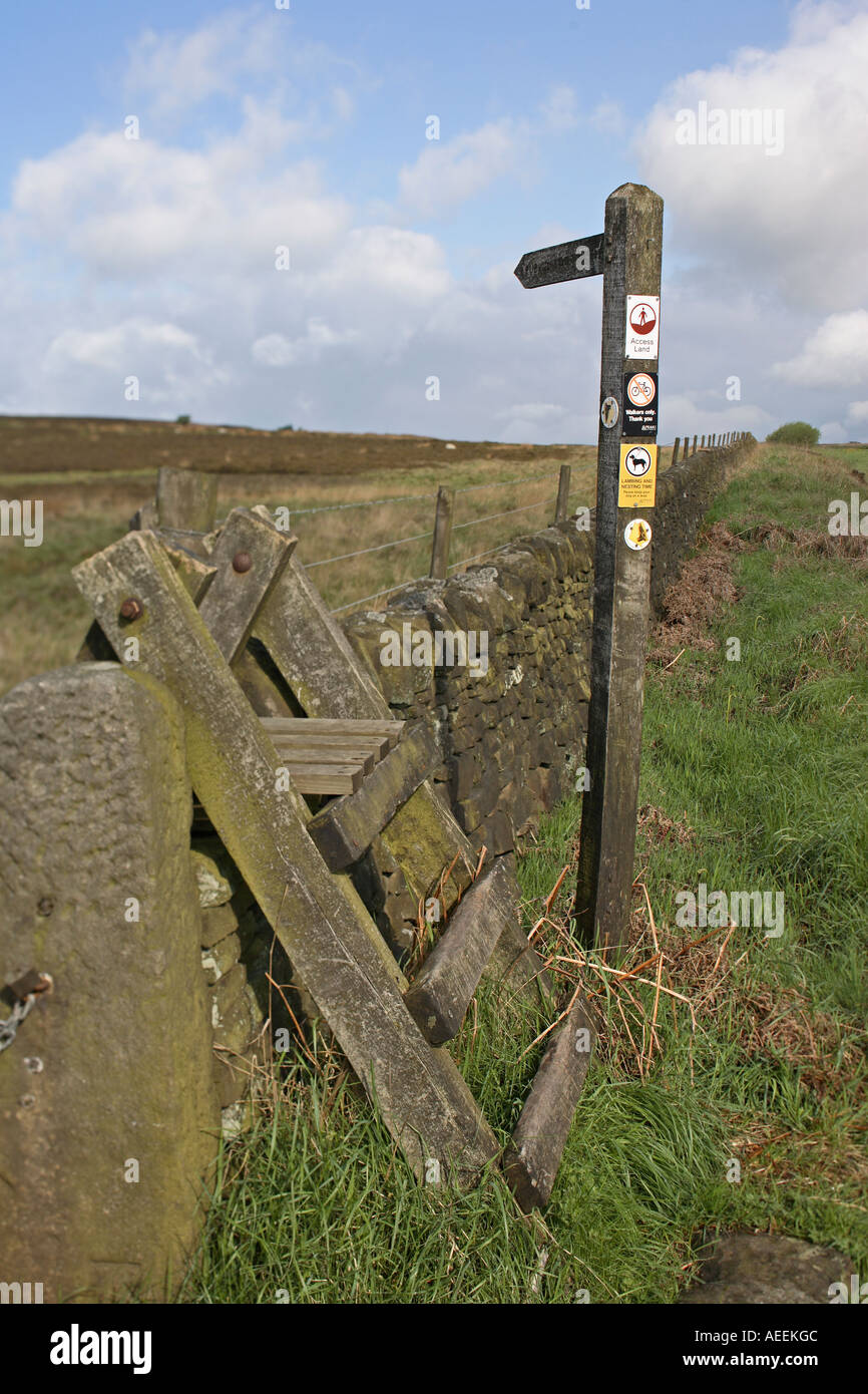 Ladder stile and footpath sign Peak District National Park Derbyshire Stock Photo