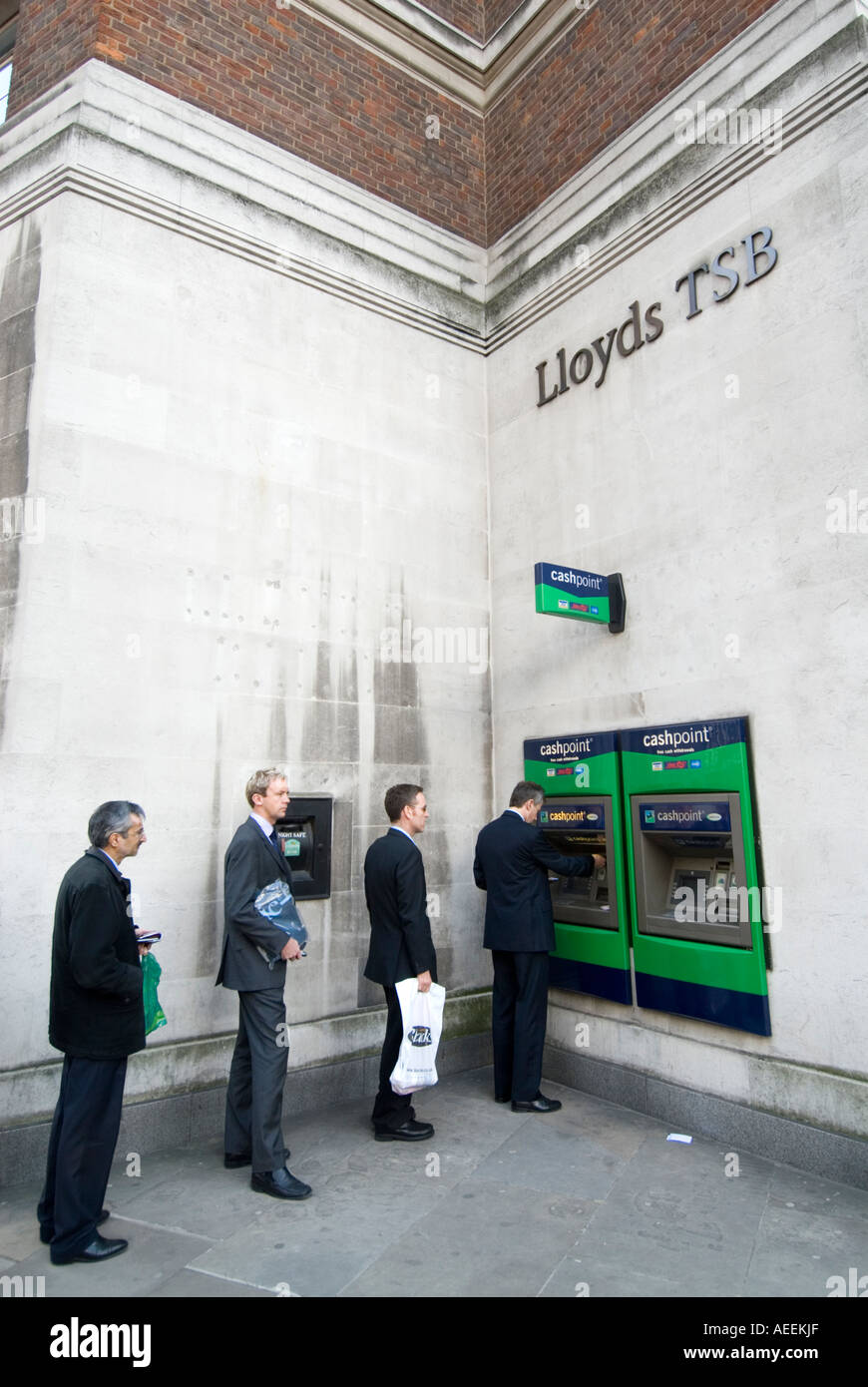 Queue at Lloyds TSB bank cash point machine, London England UK Stock Photo