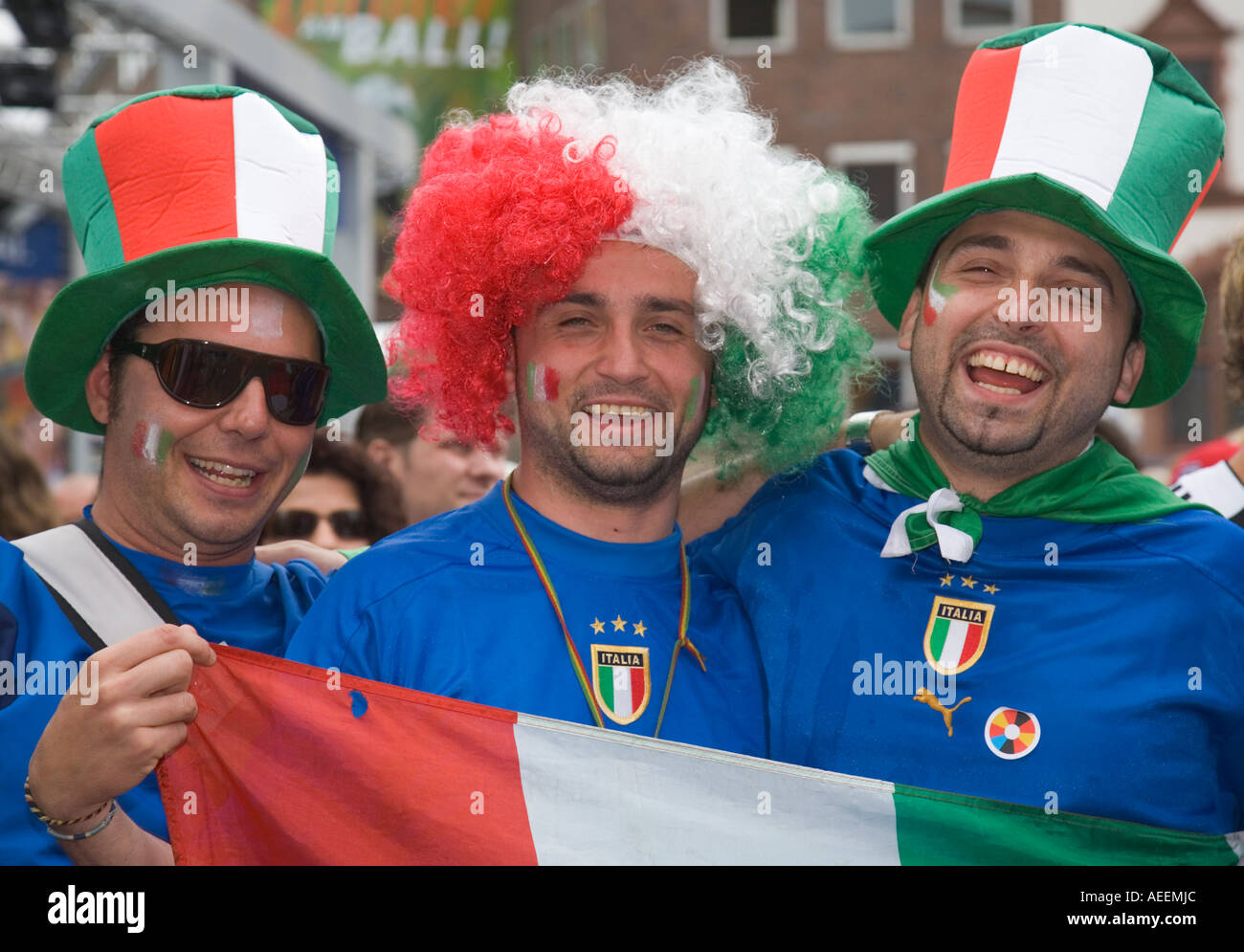 Italian football fans cheering in good mood during the world cup match Italy vs Czech Republic (2:0) at a public viewing event Stock Photo