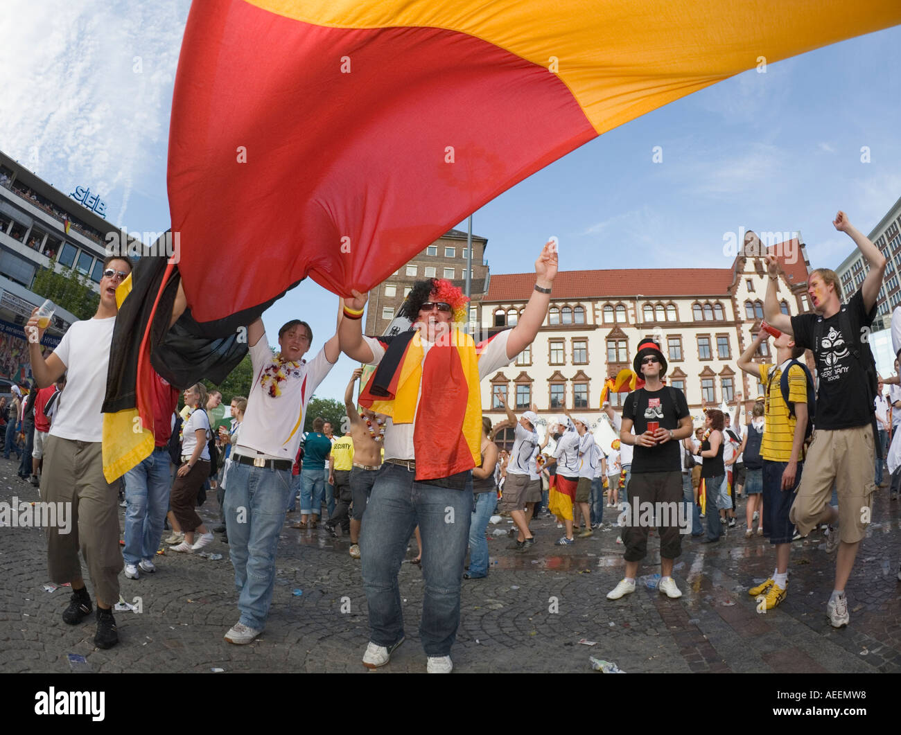 German football fans celebrating the victory of their team at a public viewing event Stock Photo