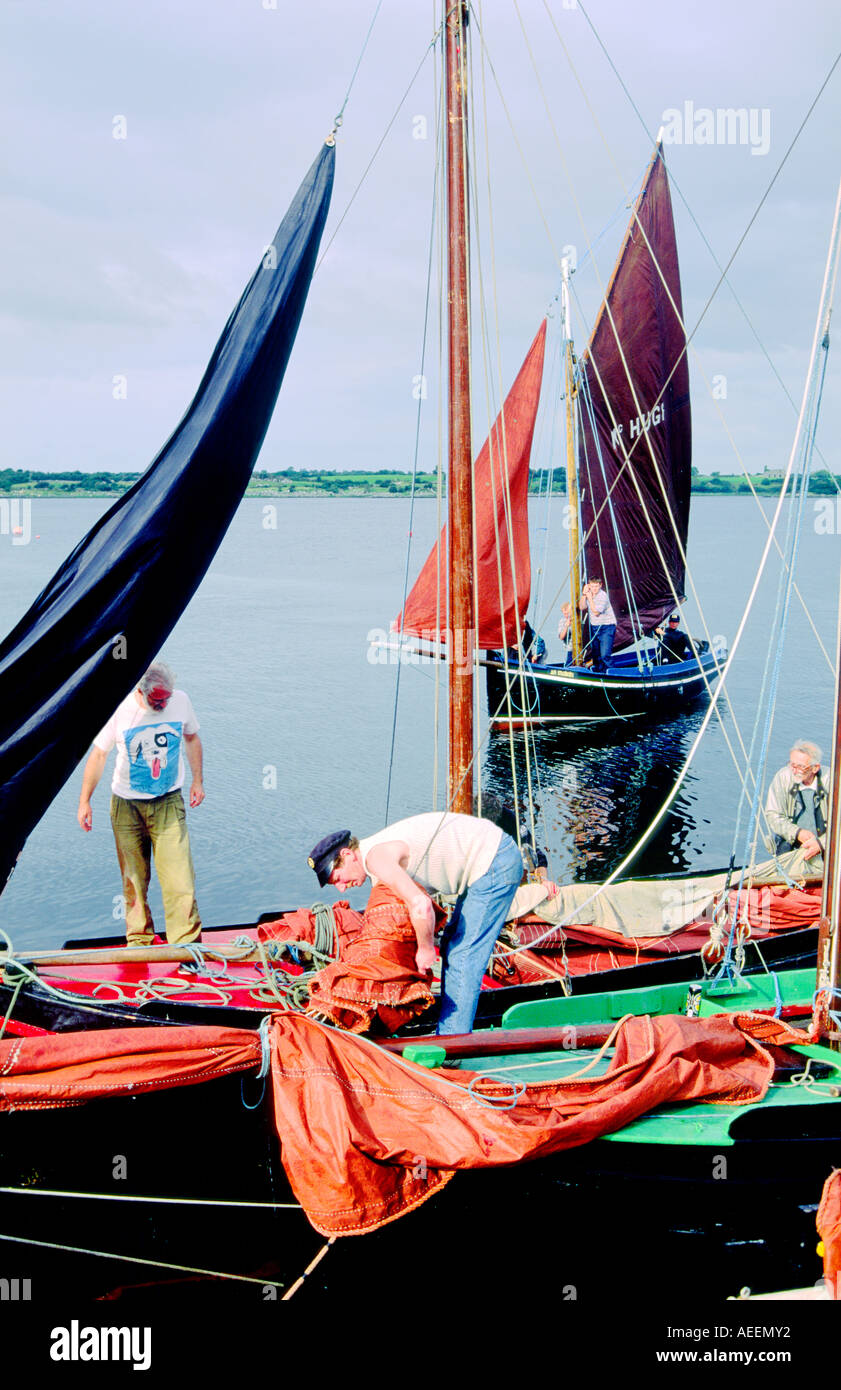 County Galway, Ireland. Traditional red sails fishing boats known as a Galway Bay hooker. Annual sailing festival at Kinvara. Stock Photo