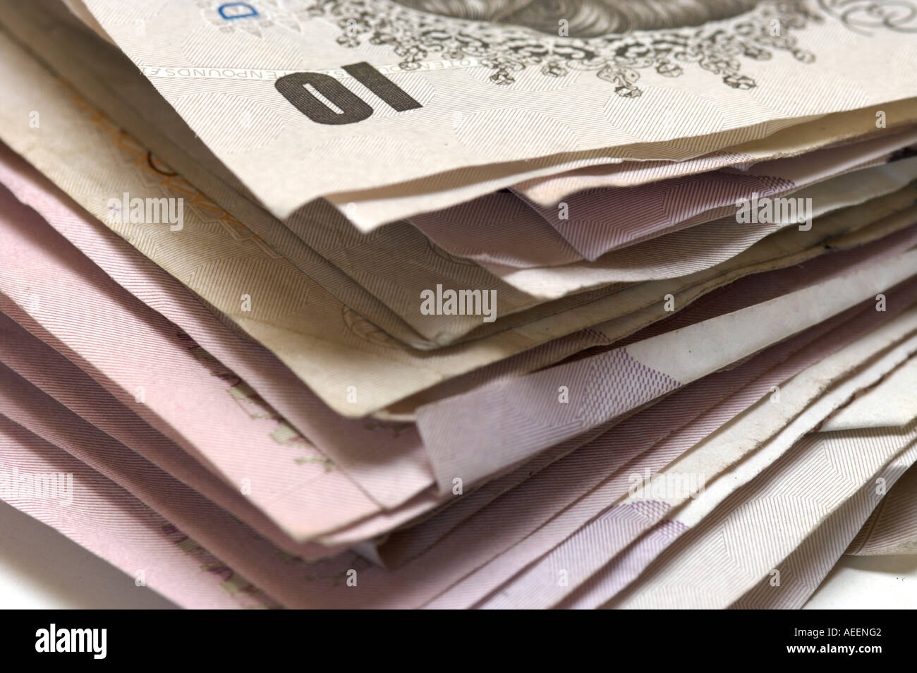 Stack of used British banknotes mixed denominations Stock Photo