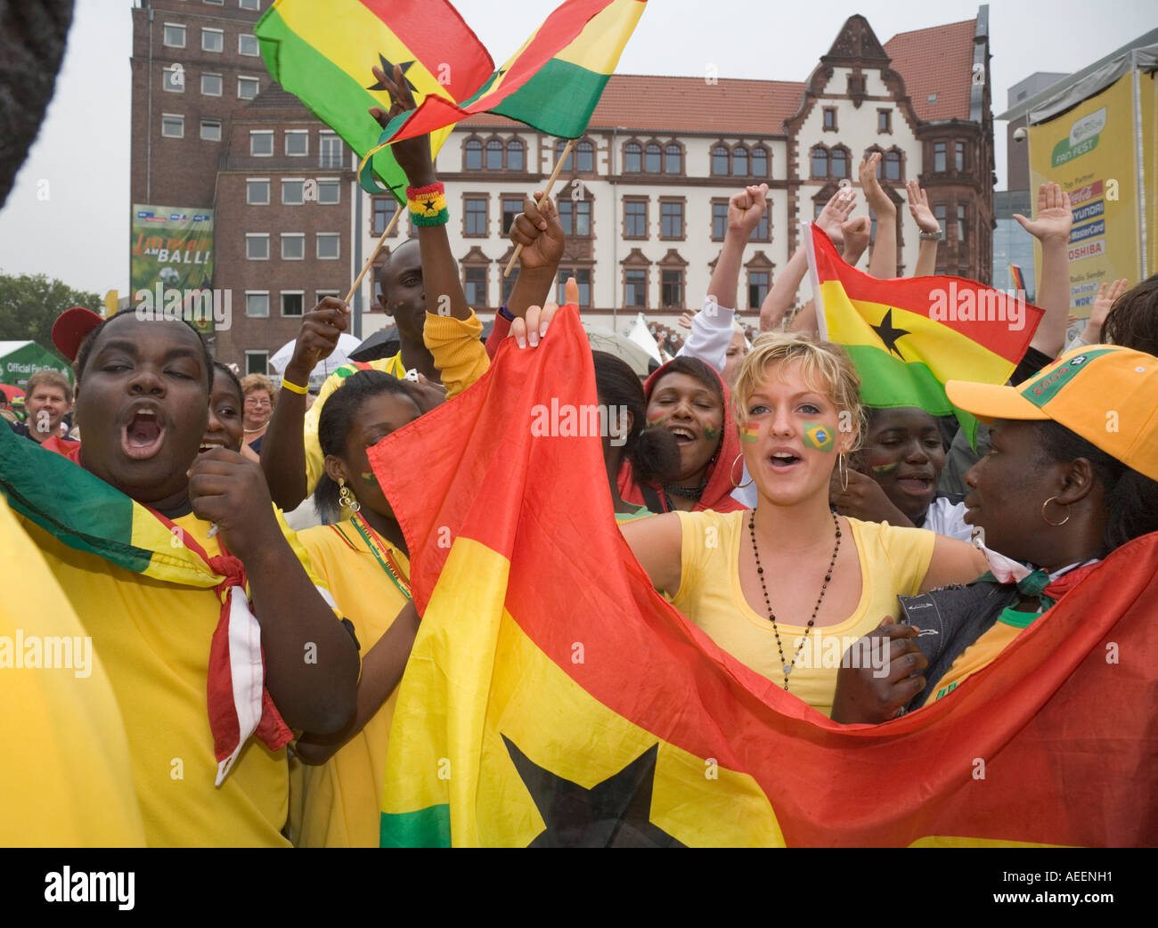 Black and white Ghanaian football fans in good mood before the world cup match Brazil vs Ghana (3:0) at a public viewing event Stock Photo